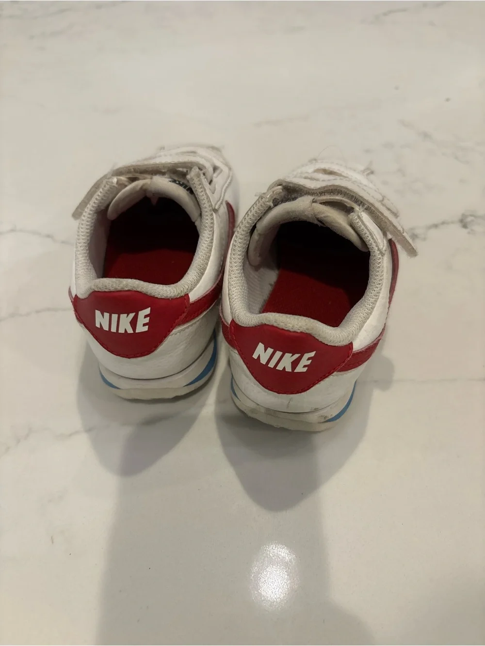 Nike Kids White Sneakers with Red Swoosh